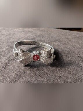 Rustic Cuff Silver Bow Bracelet with Red Accent
